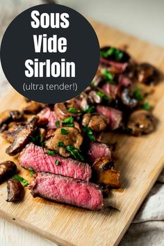 steak and mushrooms on a cutting board with the words sous vide siroin ultra tender