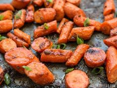 cooked carrots on a baking sheet ready to be eaten