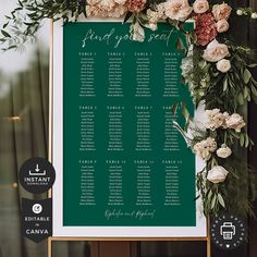 a green and white wedding seating chart with flowers on the front, along with greenery