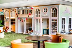 an indoor play area with toys and furniture