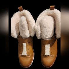 Reasonable Offers Accepted Details: Brand: Coach Size: 10b Color: Rich Tan/Cream Shearling Trim Condition: Euc; No Flaws Detected Material: Upper: Leather; Outsole: Rubber Toe Shape: Round Closure: Pull-On Heel Ht.: Low (Approx. 1" - 2") Heel Style: Wedge Seasons: Fall/Winter Coach Shoes, Platform Boots, Bootie Boots, Ankle Boots, Fall Winter, Size 10, Trim, Cream, Boots