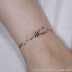 a woman's foot with a small tattoo on the left side of her leg