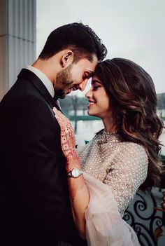 a man and woman standing next to each other