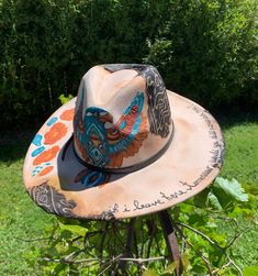 "FREEBIRD" Tan color hat, hand painted flowers, Falcon & "if i leave here tomorrow, would you still remember me ?" southwestern design 4" wide brim women's hat Includes removable hat band...hat has been burned & paint weathered.. burned fabric added for weathered distressed look...under hat has painted flowers  Make an any outfit stylish with this hand painted one of a kind walking art. Premium thick texture paint. Polyester material Size 59cm   Brim: 4" Hat Height 5"  Please read hat measuremen Artsy Adjustable Fedora With Curved Brim, Artistic Fedora Hats For Country Events, Artistic Fedora For Country Events, Bohemian Multicolor Hat For Western-themed Events, Artsy Adjustable Hat With Curved Brim, Adjustable Artsy Hats With Curved Brim, Bohemian Flat Brim Hand Painted Hat, Bohemian Hand Painted Adjustable Hat, Adjustable Bohemian Hand Painted Hat