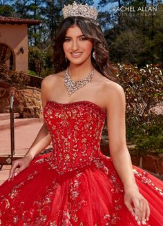 a woman in a red dress with a tiara