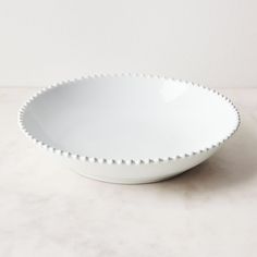 a white bowl sitting on top of a table