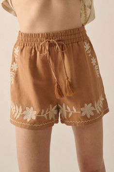 Linen-blend shorts. Floral embroidery. Elastic waist with tassel drawstring. Side pockets. Wide leg. Thigh length. Relaxed fit. 70% Rayon, 30% Linen. Imported. Designed in LA. Model wears size S. Boho Clothes, Boho Outfits, Floral Embroidery, Printed Shorts, Season Spring, Linen Blend, Tassels, Elastic Waist, Wide Leg