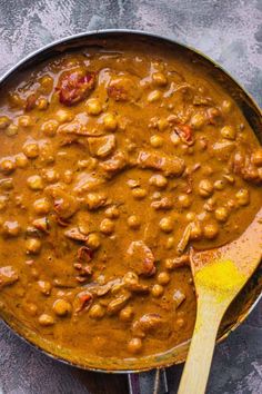 a skillet filled with beans and meat