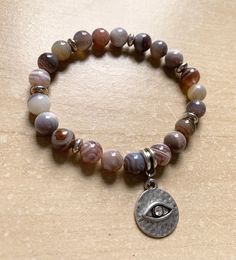 Product Materials: 8mm Botswana Agate beads with silver toned Evil Eye charm Product Type: stretchy bracelet window.dataLayer = window.dataLayer || []; function gtag(){dataLayer.push(arguments);} gtag('js', new Date()); gtag('config', 'AW-645572217'); Silver Agate Stretch Bracelet Gift, Silver Agate Stretch Bracelet, Silver Agate Stretch Bracelet With Natural Stones, Botswana Agate, Stretchy Bracelets, Evil Eye Charm, Agate Beads, Botswana, Evil Eye