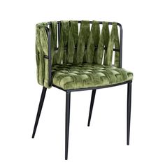 a green velvet chair with black legs and armrests on an isolated white background