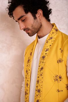 Editor's Note Featuring Canary Yellow Short Jacket With Hand Embroidered Borders And Pintuck Details. Paired With Ivory Kurta And Tapered Trousers. Fabric: Linen Silk Color: Yellow, Ivory Component: Shrug, Kurta, Trousers Care: Dry Clean Only About the Designer After establishing himself as the leading couturier in the industry of menswear, Jatin Malik went on to explore luxury footwear. You can order online these amazingly designed handmade shoes that are being offered in classy Caligae and Pes Jatin Malik, Yellow Short, Tapered Trousers, Canary Yellow, Satin Color, Yellow Shorts, Band Collar, Kurta Set, Floral Motifs