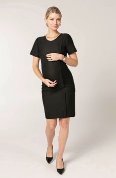 This maternity dress is a remix of a classic A-line design, featuring a sheath silhouette and stretch built for every phase ofpregnancy. Hidden zips under princess seam allow for discreet breastfeeding access. 38 1/2" length Jewel neck Back zip closure Short sleeves 38% recycled polyester, 36% polyester, 21% viscose, 5% elastane Hand wash, dry flat Imported Fitted Black Maternity Dress, Elegant Bump-friendly Maternity Dress, Fitted Knee-length Maternity Dress, Nursing Friendly Fitted Knee-length Dress, Knee-length Fitted Nursing-friendly Dress, Fitted Short Sleeve Bump Friendly Maternity Dress, Fitted Bump Friendly Maternity Dress With Short Sleeves, Elegant Fitted Maternity Dress Nursing Friendly, Elegant Short Sleeve Maternity Dress Bump Friendly