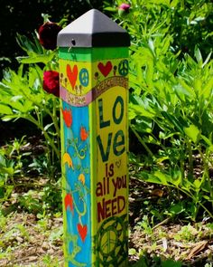 there is a colorful post with the words love is all you need