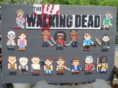 the walking dead cross stitch pattern is displayed in front of a sign that reads, the walking dead