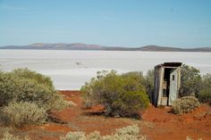 an outhouse in the middle of nowhere