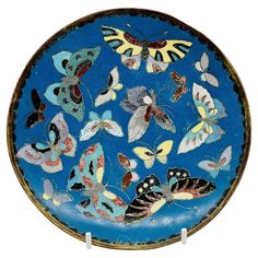 a blue plate with lots of butterflies on it