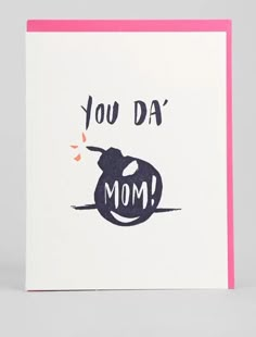 a card with the words you da mom written in black and pink ink on it