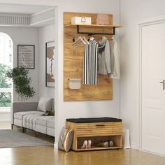 a living room filled with furniture and a wooden wall mounted coat rack on the wall