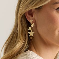 Dangling shiny and matte gold stars ending with a delicate three dimensional star surrounding a white pearl bead. These will light up the room like fireworks on the 4th of July. Hypoallergenic Ultra Lightweight Length 2.5 Gold- Plated Waterproof Star Drop Earrings, Casual Earrings, Bold Accessories, Gold Statement Earrings, Statement Drop Earrings, Color Dorado, Shooting Stars, Beaded Bags, Fashion Sale