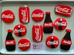 coca - cola cookies are arranged on a tray