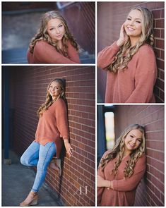 a beautiful woman leaning against a brick wall