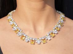 Yellow Diamond Necklace featuring semi precious canary yellow stones and cz diamond. Ideal jewelry to pair with your bridal wedding gown and prom gown. This Victorian Style LUXURY necklace will surely elevate your look. Perfect gift for Her. *𝐏𝐑𝐎𝐃𝐔𝐂𝐓 𝐃𝐄𝐓𝐀𝐈𝐋* * 𝐌𝐚𝐭𝐞𝐫𝐢𝐚𝐥: Brass * 𝐏𝐥𝐚𝐭𝐢𝐧𝐠: White Rhodium Plated * 𝐒𝐭𝐨𝐧𝐞: AAA-quality CZ Diamond & Canary. *𝐃𝐈𝐌𝐄𝐍𝐒𝐈𝐎𝐍𝐒* *𝐍𝐞𝐜𝐤𝐥𝐚𝐜𝐞* * 𝐖𝐞𝐢𝐠𝐡𝐭: 75 gm * 𝐋𝐞𝐧𝐠𝐭𝐡: 16.5 Inches * 𝐖𝐢𝐝𝐭𝐡: 0.6 Inches Etsy Jewelry Necklace, Yellow Diamond Jewelry, Yellow Diamond Necklace, Canary Yellow Diamonds, Statement Necklace Wedding, Crystal Wedding Necklace, Hollywood Jewelry, Yellow Canary, Blink Blink