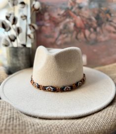 Western style macrame adjustable hat band. Handmade with copper colored 100% cotton cord and western style frayed cotton fabric. This simple rustic hat band is adjustable, perfect for any hat.  **Hat Band Only** Please message me if you have any questions. Thank you for visiting my shop! Happy Hanging! Bohemian Beige Hat Band For Western-themed Events, Beige Western Hat Bands For Western-themed Events, Handmade Bohemian Hat Bands For Western-themed Events, Handmade Blue Hat Bands For Western-themed Events, Artisan Hat Band For Rodeo, One Size Fits Most, Western Style, Chapeau Cowboy, Cowgirl Hats, Cow Girl