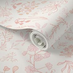 a wallpaper with pink flowers and leaves on white background, it looks like the wrapping paper has been rolled up