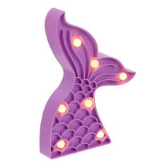 a purple mermaid tail shaped light up decoration