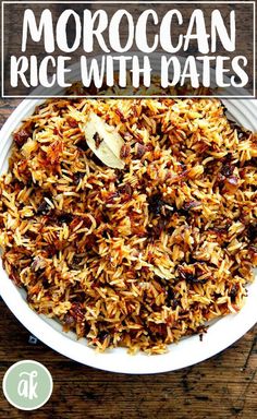 a white bowl filled with rice on top of a wooden table