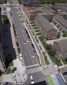 an aerial view of a city street and parking lot