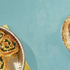 two plates with pastries on them next to a yellow and white plate holding some food