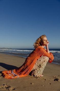 Orange Handmade Knit Cardigan-Dress is spun from a soft silk-blend cotton and silk. This long light handmade knit cardigan-dress definitely makes you unique during summer time. The cardigan looks perfect from casual style to evening dresses. Product Details Composition: cotton & silk  Belt Dry cleaning only Model is wearing size S Cardigan Outfit Summer, Crochet Beachwear, White Crochet Crop Top, Crochet Beach Dress, Crochet Midi Dress, Cardigan Dress, Orange Cardigan, Handmade Knitwear, Long Lights