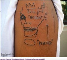 a man with a tattoo on his arm that says evil thought is reversed in black ink