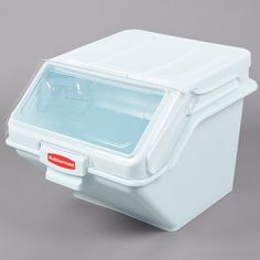 an ice chest with the lid open on a gray background, showing water in it