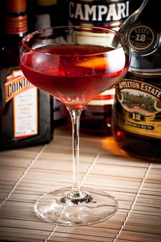 a close up of a wine glass on a table