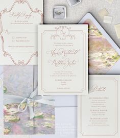 the wedding stationery is laid out on top of each other