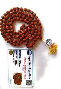 This 5 Mukhi Rudraksha mala is lab tested (Jaipur Gemological Lab) for its authenticity proof. Bead Size: 8mm to 9 mm The Rudraksha bead acts like a protective guard that safeguards its wearer from negative energies. Wearer of Rudraksha mala gets the blessings of Lord Shiva. Balances the chakras Brown Mala For Healing And Festivals, Spiritual Brown Mala For Festivals, Brown Spiritual Mala For Festivals, Brown Round Beads Mala For Puja, Brown Mala With 8mm Beads For Puja, Brown Hand-strung Mala For Festivals, Brown Mala With Round Beads For Puja, Traditional Brown Mala As Gift, Brown Hand-strung Mala For Puja