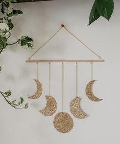 three phases of the moon hanging on a wall