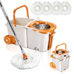 an orange and white mop is next to a bucket