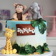 there is a cake decorated with animals on it