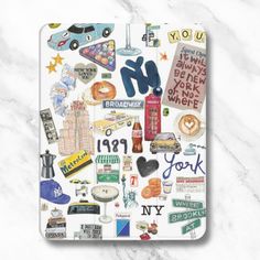 the new york sticker sheet is shown on a white marble surface with words and symbols