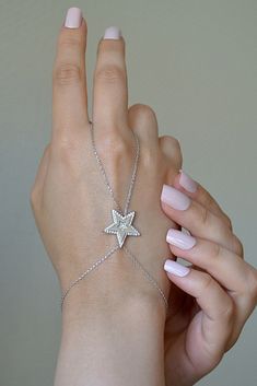 925 Sterling Silver Chain Star Necklace, Silver Colour Filled Finger Bracelet, Chain, Hand Chain Bracelet and Ring ❤️925 Sterling Silver Hand Chain ❤️ ❤️WE ARE HERE TO ADD MORE BEAUTY TO YOUR BEAUTY WITH OUR JEWELRY ❤️ ❤️ OUR DESIGNS ARE LIKE A LOVER AT YOUR SIDE ALL THE TIME ❤️ DOES NOT DARKEN ANTI - ALLERGENIC Excellent quality and reasonable price This jewelry is elegant, stylish and useful and Ideal Gifts for Christmas, Mother's Day, Valentine's Day, Graduation Gifts, Bridal Gifts Anniversar Sterling Silver Party Jewelry With Star Charm, Sterling Silver Star Jewelry For Party, Silver Star-shaped Jewelry With Adjustable Chain, Silver Star Jewelry For Party, Sterling Silver Star-shaped Jewelry, Elegant Silver Jewelry With Star Charm, Silver Star Of David Charm Jewelry, Silver Chain Bracelet For Party Fine Jewelry, Silver Chain Bracelet For Party In Fine Jewelry Style