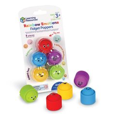 the rainbow embellishments finger puppets are packaged in different colors and shapes, including smiley faces