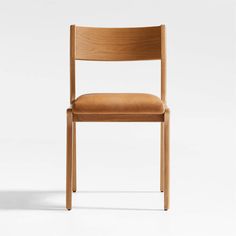 a wooden chair with a tan leather seat and back rest, viewed from the front