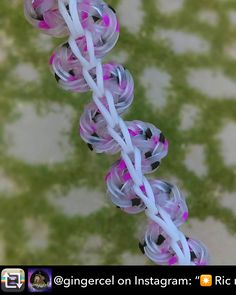 an overhead view of several plastic balls with white string attached to the top and bottom