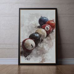 a painting of billiards balls in a row on the wall next to a wooden floor