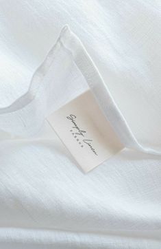 a white shirt with a label on it