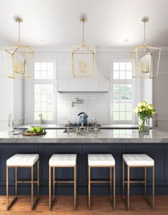 a kitchen island with four stools in front of it and three lights hanging from the ceiling