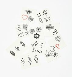 the temporary tattoos are all different shapes and sizes, but they have been drawn on them